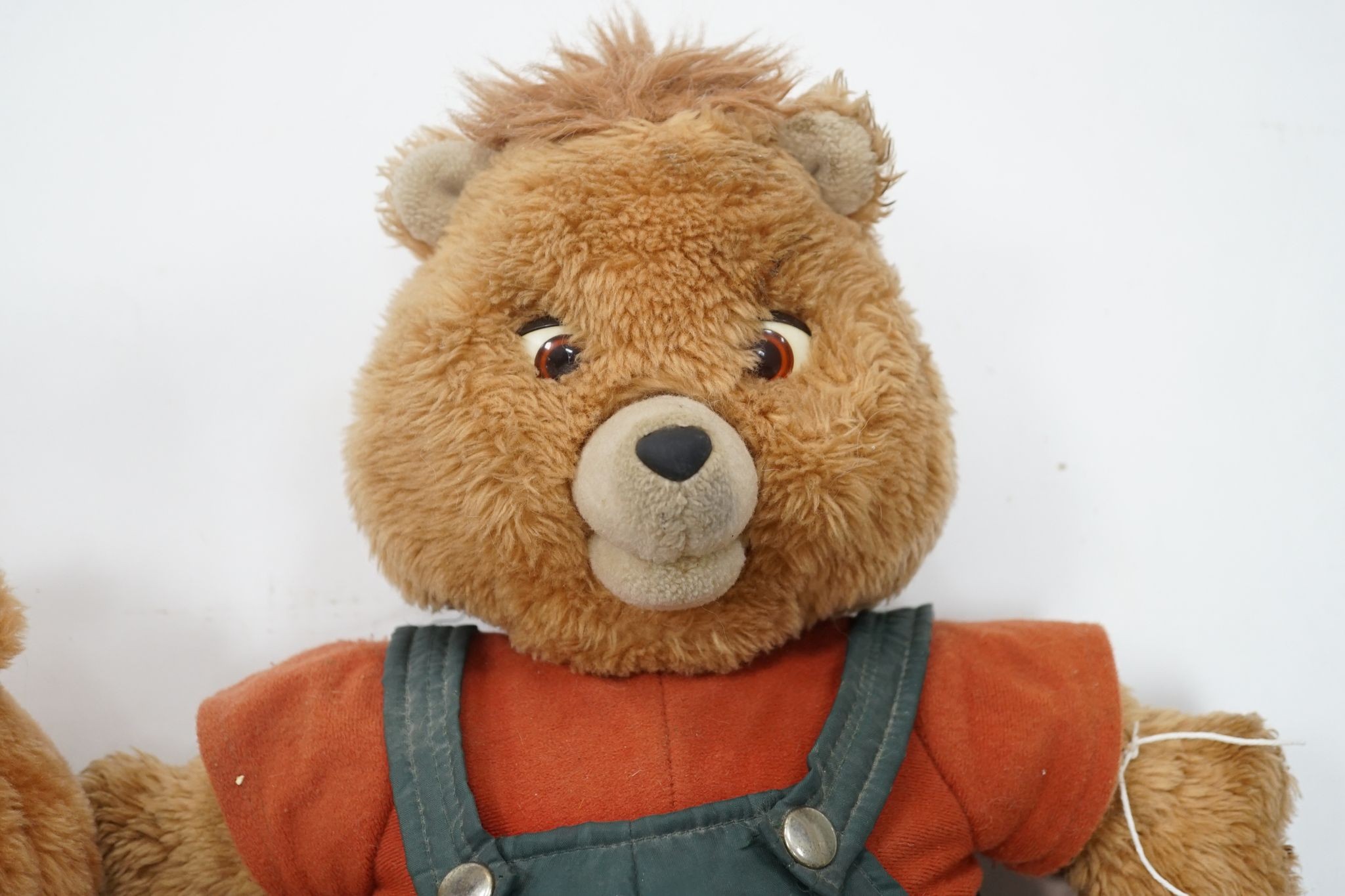 A Teddy Ruxpin 1950's, good condition, Musical Play Tapes Animatronic, has box, literature and tapes, together with another unboxed, no tapes